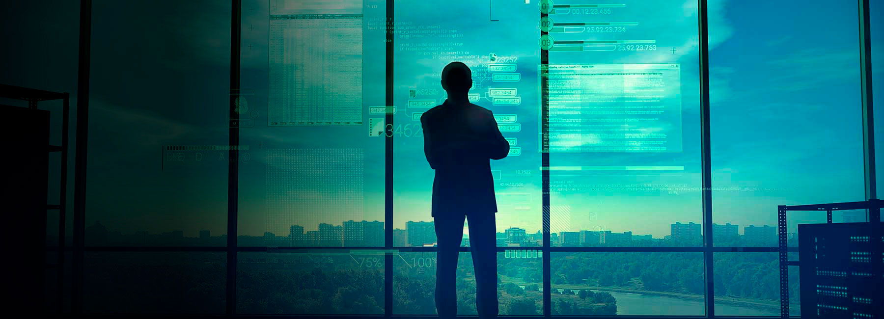 Man analyzing data on screen, highlighting Cyber Risk & Compliance for better decisions, Cybersecurity | DXC Technology Services