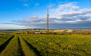 cell tower near farmland | DXC Technology Customer Story